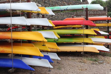 Colorful kayaks in stackの写真素材