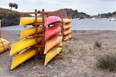 Colorful kayaks in stackの写真素材