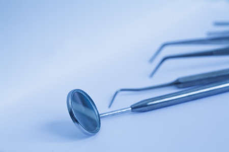 Dentist's instruments with shallow depth of field blue tintedの写真素材