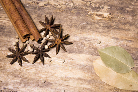 Star anise, cinnamon sticks  on a wooden backgroundの写真素材