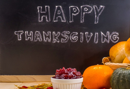 Happy Thanksgiving word cloud on a vintage slate blackboard.の写真素材