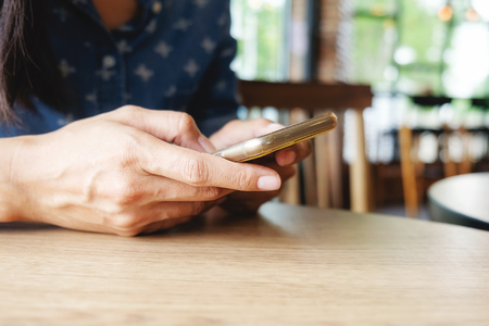 Beautiful young asian woman using smartphone and holding card for shopping online payment . Shopping concept with copy space. Online shopping concept.の写真素材