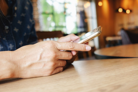 Beautiful young asian woman using smartphone and holding card for shopping online payment . Shopping concept with copy space. Online shopping concept.の写真素材