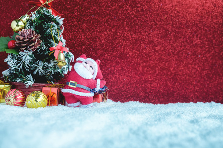 Christmas decorations with snow and red background.close up and selective focus.の写真素材