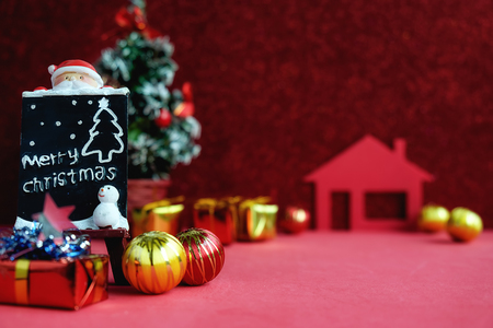 Christmas decorations with snow and red background.close up and selective focus.の写真素材