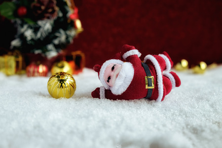 Christmas decorations with snow and red background.close up and selective focus.の写真素材