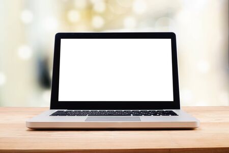 Computer with white screen on table with blur background. Technology concept.の写真素材