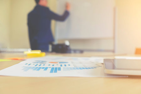 Business concept with copy space. Office desk table with pen focus and analysis chart, computer,...