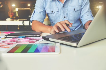 Artist drawing on graphic tablet in officeの写真素材