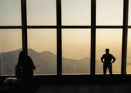 Silhouette of Business People Posing by Windowの写真素材