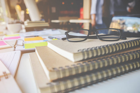 Business concept with copy space. Office desk table with glasses focus and analysis chart  computer ...