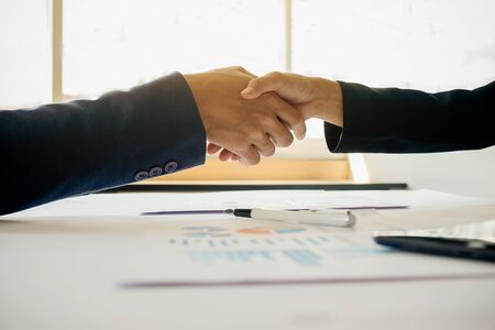 Business handshake and business people.Vintage tone Retro filter effect,soft focus,low light.の写真素材