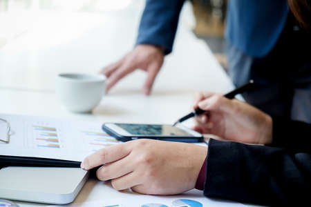 Business concept.Image of  young businessmen using touchpad at meeting. Selective focus.の写真素材