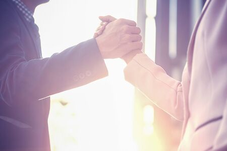 Business partnership meeting concept. Successful business handshaking after good deal. Horizontal blurred background.の写真素材