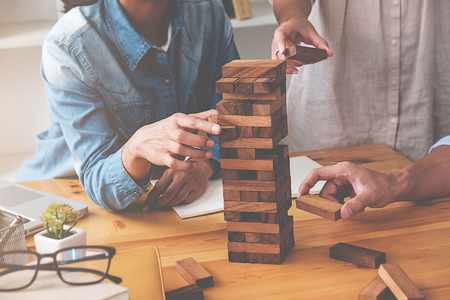 Education concept. Students studying and brainstorming campus concept. Close up of students discussing their subject on books textbooks and writing to notebook. Selective focus.の写真素材
