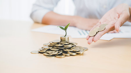 Saving money to invest in house or property in the future. Business Finance Concept.の写真素材