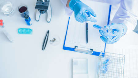 Sad dismissed businessman sitting outside the office after losing his jobの写真素材