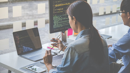 Programmers working in a software development and coding technologies. Website design. Technology concept.の写真素材