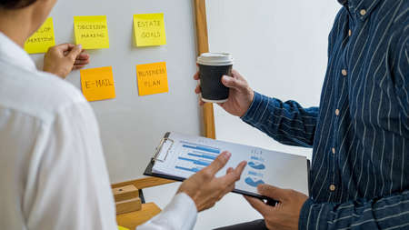 Start up partners are discussing the ideas for new strategy of development.の写真素材