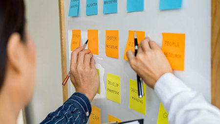 Start up partners are discussing the ideas for new strategy of development.