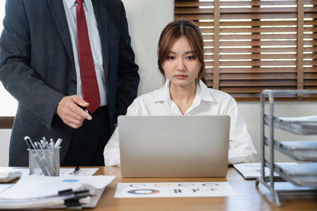 businessman and businesswoman working with laptop computer in modern office.の写真素材