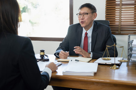 Male lawyer having meeting with client in office. Law and Legal services concept.の写真素材