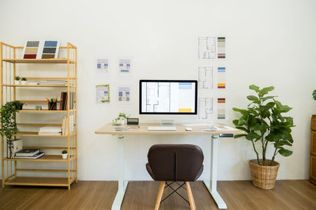 Designer's desk with computer in modern office, interior design concept