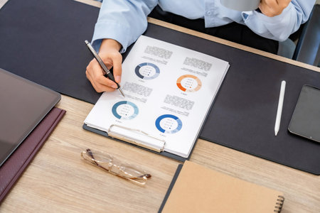 Businessman analyzing investment charts in office. Business concept.の写真素材