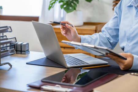 Businesswoman working with laptop at office desk. Business and technology concept.の写真素材