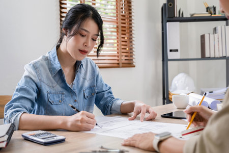 Architect or engineer working on blueprint in office. Architect concept.の写真素材