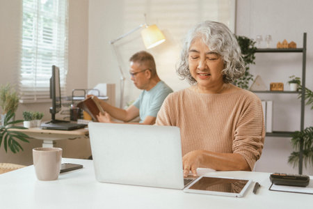 senior couple and documents with laptop for finance, budget planning or retirement annuity on sofa....