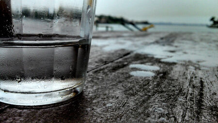 A glass of water on the rainの写真素材