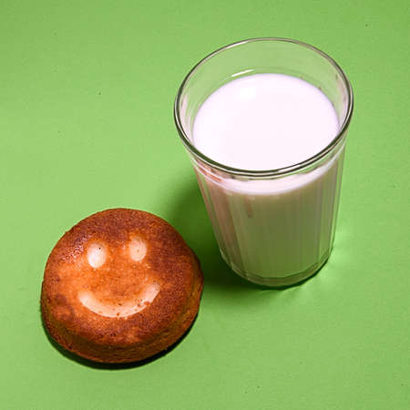 a glass of milk with a donutの写真素材
