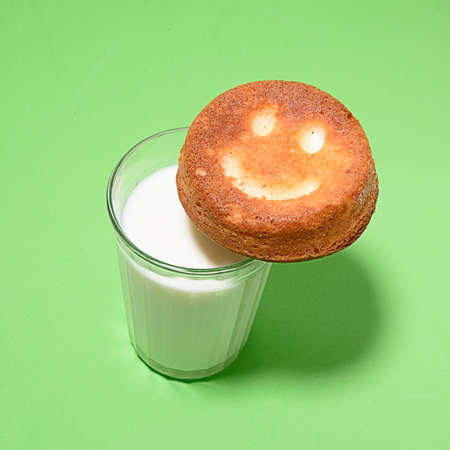 A glass of milk with a donutの写真素材