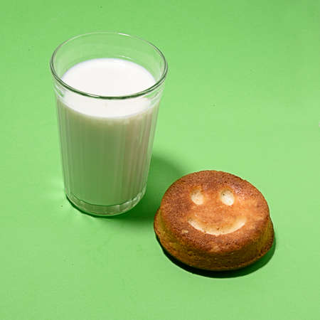 a glass of milk with a donutの写真素材