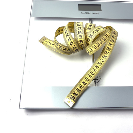 scales and cm for tracking your weight, which a lot or a little, everyone decides for himselfの写真素材