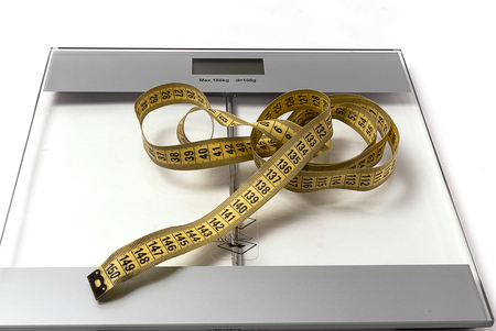 scales and cm for tracking your weight, which a lot or a little, everyone decides for himselfの写真素材