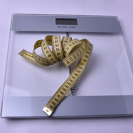 scales and cm for tracking your weight, which a lot or a little, everyone decides for himselfの写真素材