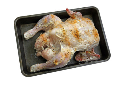 A tray of freshly prepared uncooked chicken の写真素材