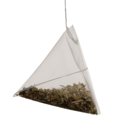 tea bag as a pyramid of on  white backgroundの写真素材