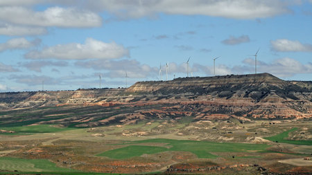 Wind turbines against the sky in fields of Spain