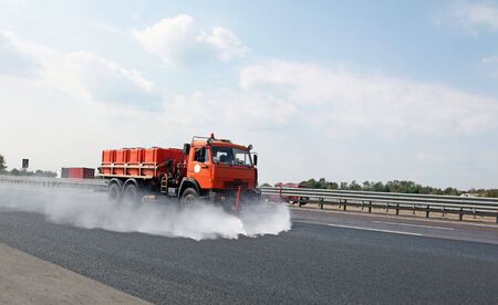 The special truck washes road with waterの写真素材