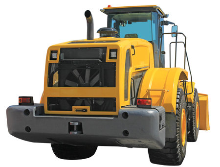 The big yellow powerful heavy tractor on wheels