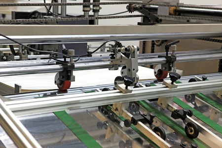 Part of the machine of offset printing - paper giving in the mechanismのeditorial素材