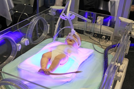 Newborn baby incubator with a dummy of the childのeditorial素材