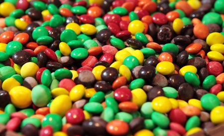 Background of colorful candies coated chocolate sweets の写真素材