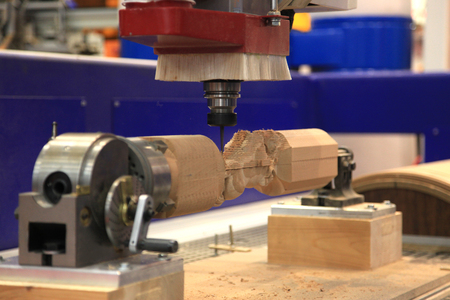 CNC machine for machining complex parts made of woodの写真素材