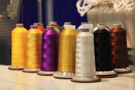 Spools of thread at a textile knitting machine