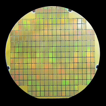 Silicon wafer with chips isolated on black backgroundの写真素材