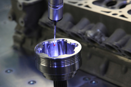 Detail of the tip of a 3d laser scanner mechanical arm, with laser beam scanning a surface.の写真素材